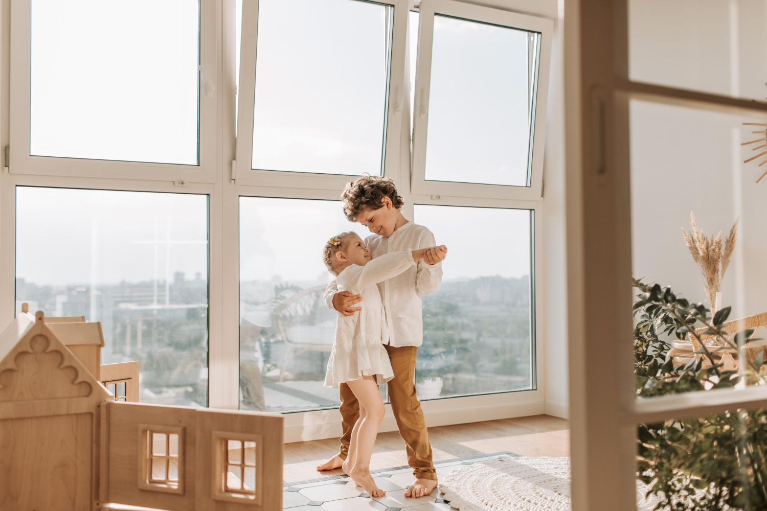 free-photo-rakshabandhan-young-couple-embrace-front-window